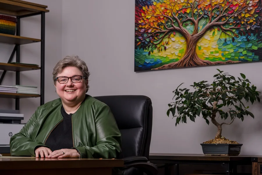 A welcoming office with an attorney seated at the desk