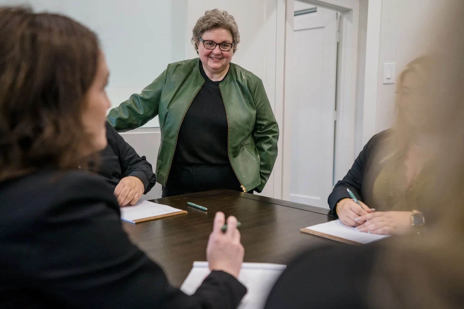 The firm’s team discussing a matter around the conference table